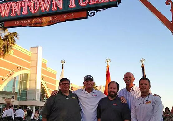 The Penn Signs team standing in Downtown Yuma